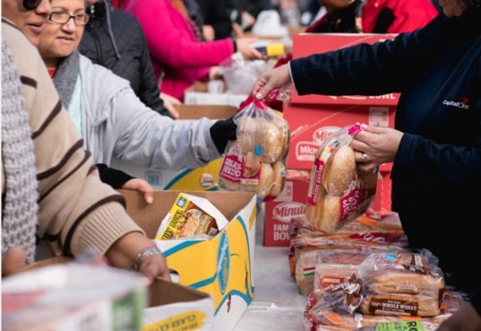 Volunteers hand out food