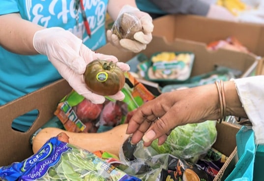 Woman handing client food