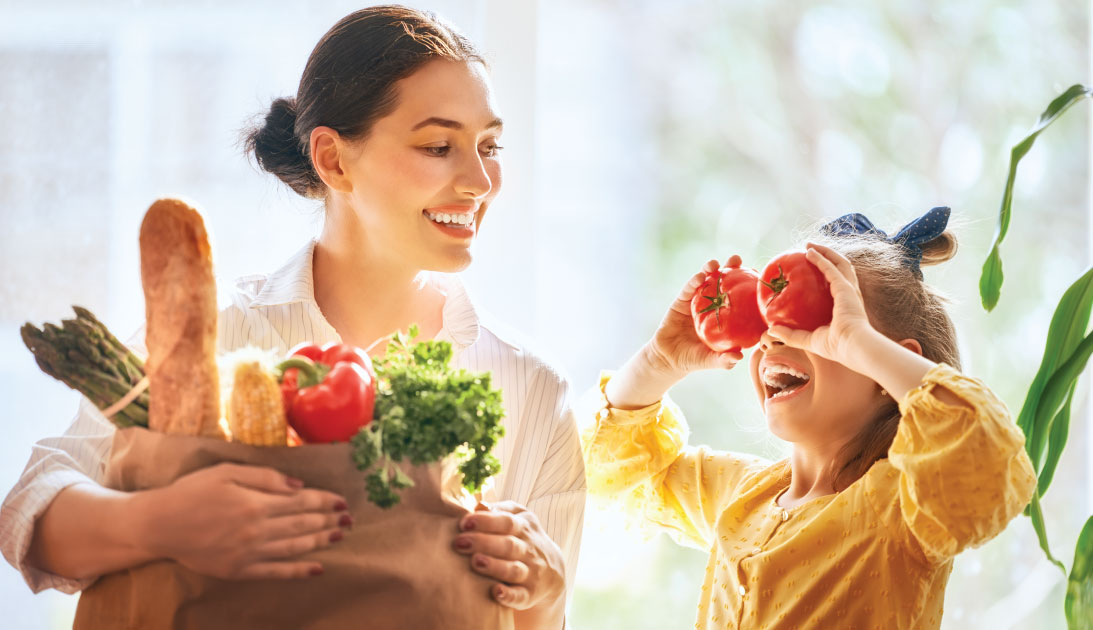 Mother and daughter shop for groceries