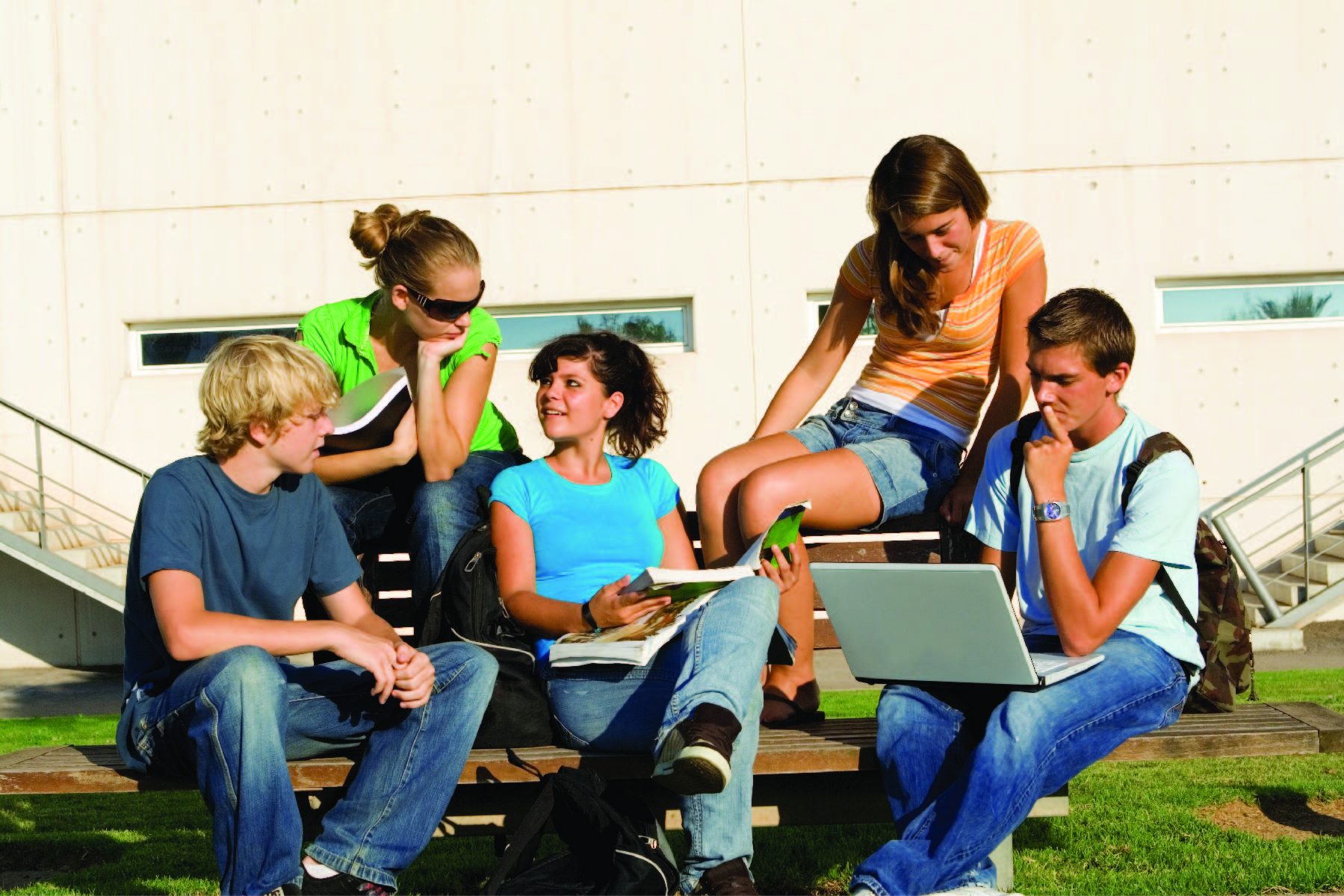 Students sit at table talking