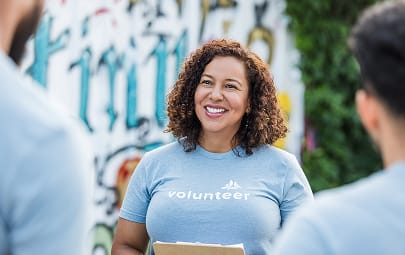 A volunteer reviewing strategy with other volunteers